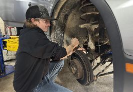  Student works on tire well